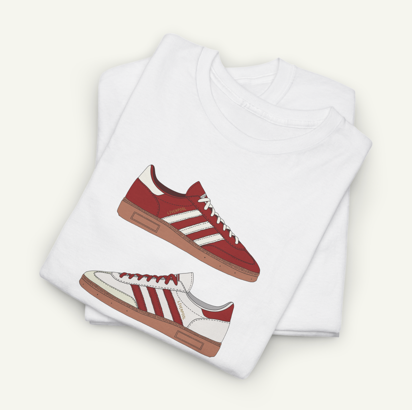 A white t-shirt with a graphic design of a red and white Adidas sneaker printed on it.