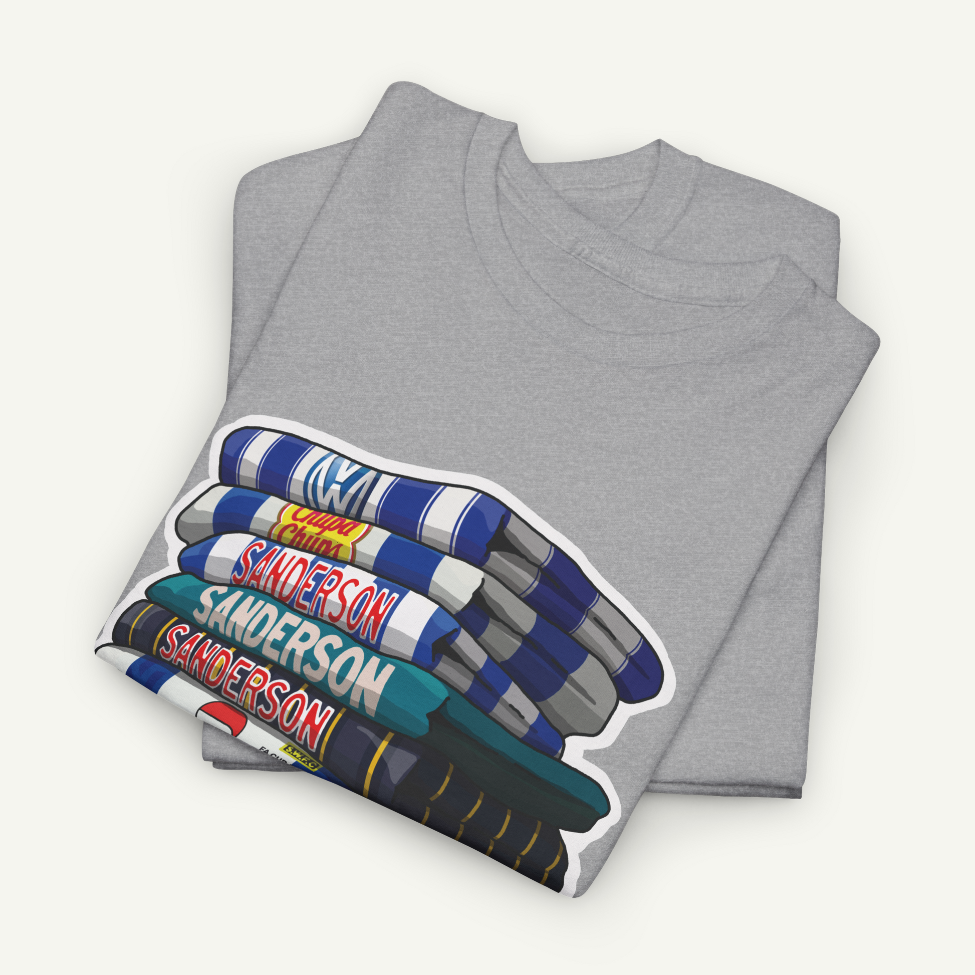 A gray t-shirt with a graphic design depicting a stack of books with the name 'Sanderson' printed on them.