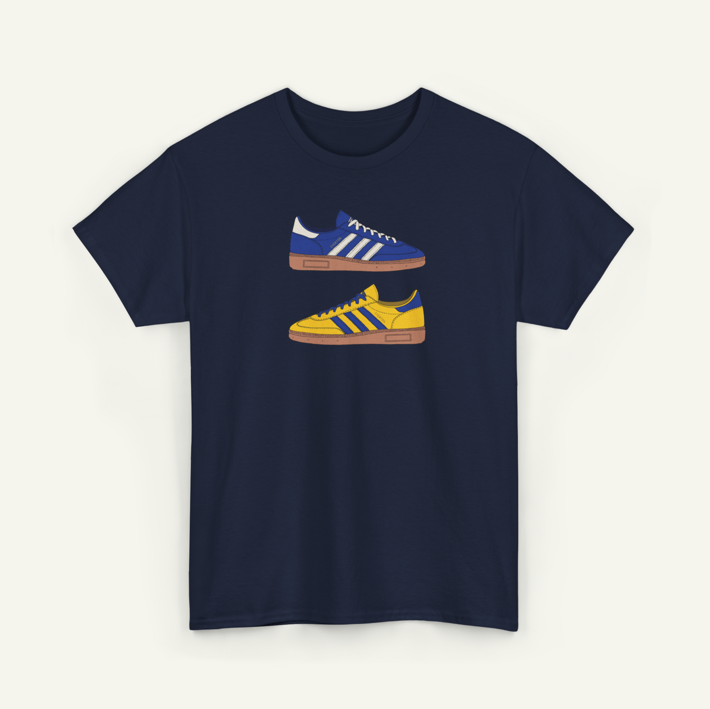 A navy blue t-shirt with a graphic design of two Adidas sneakers in blue and yellow colors.