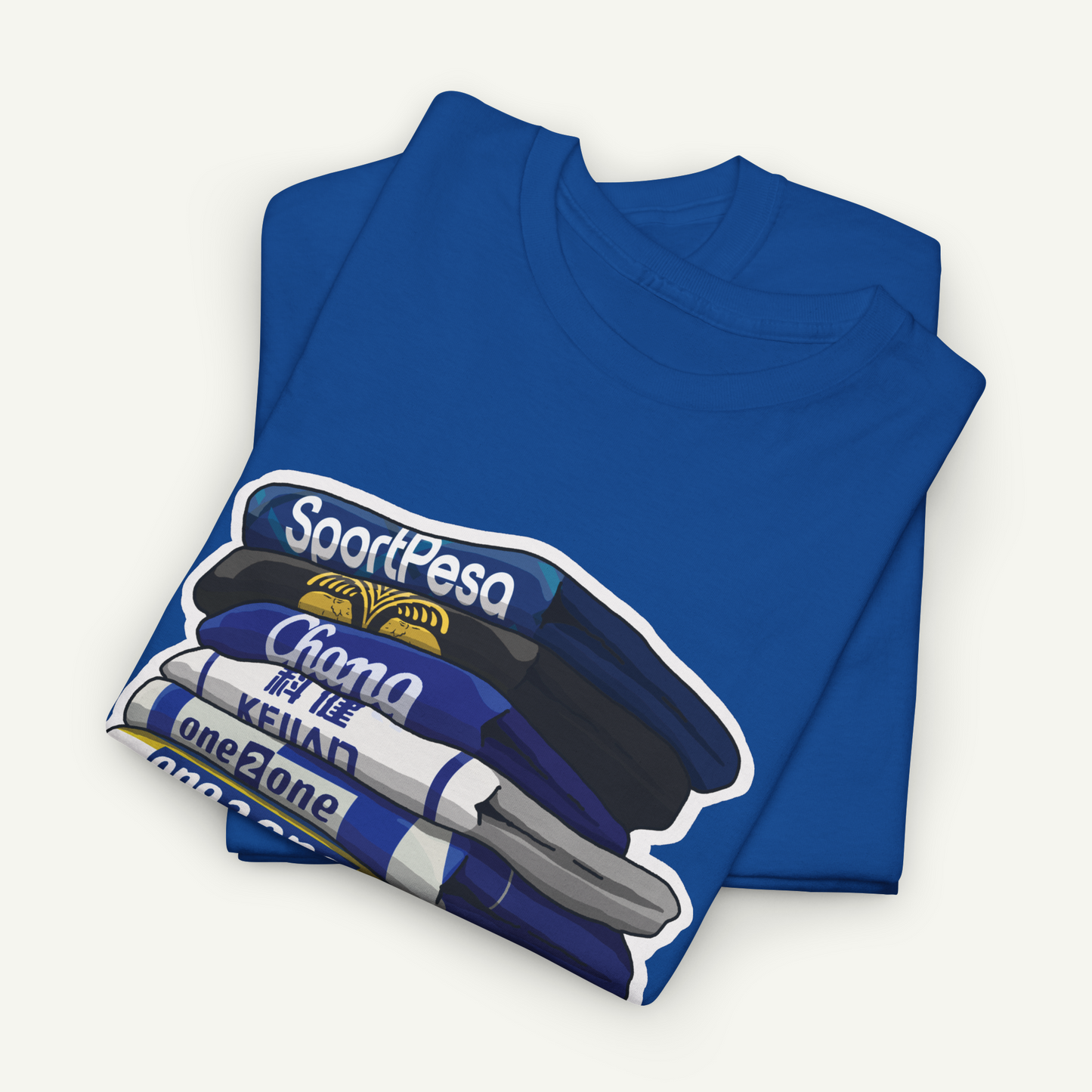 A blue t-shirt with a graphic design depicting a stack of books or a stack of blue and white items.