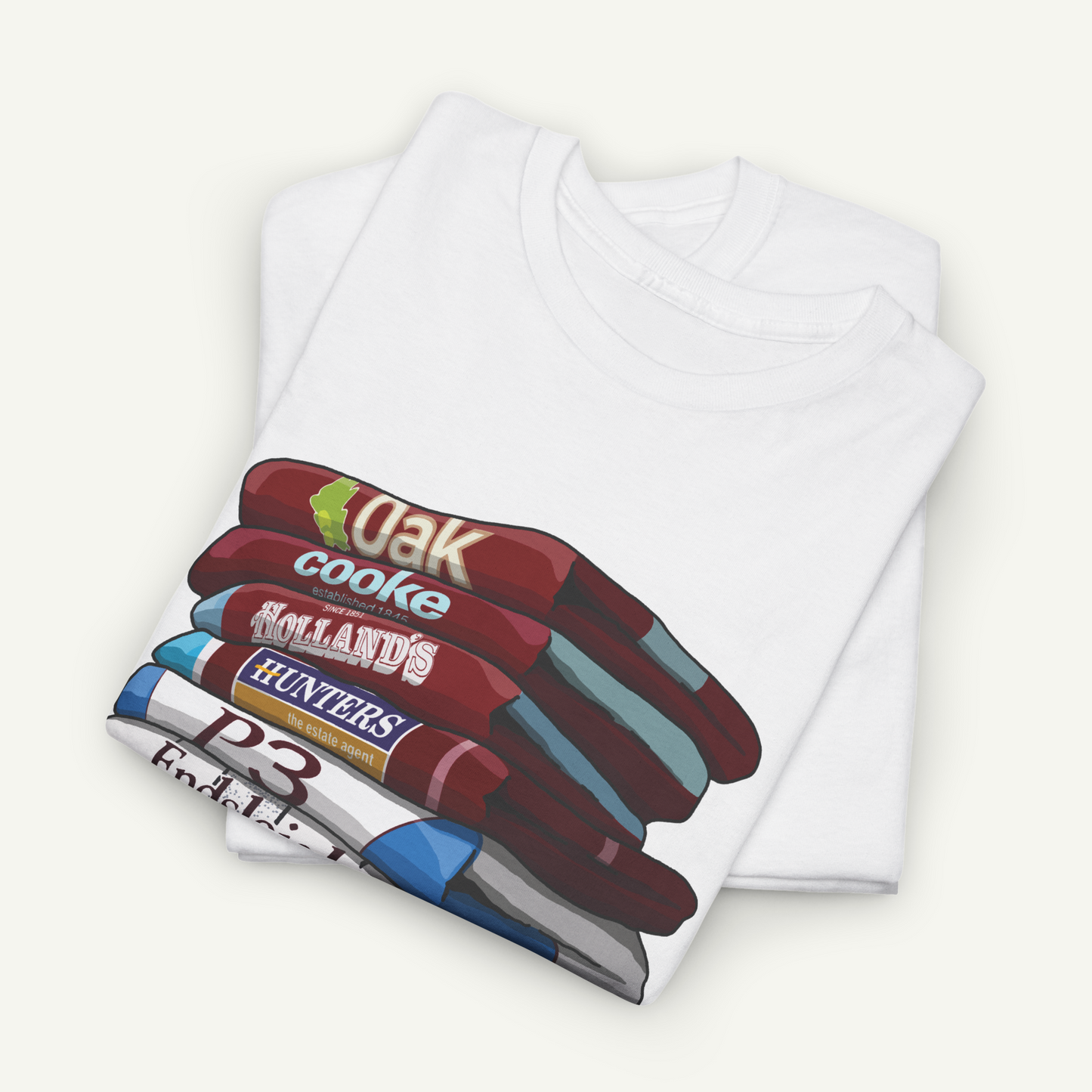 A white t-shirt with a graphic design depicting a stack of various colored pencils.