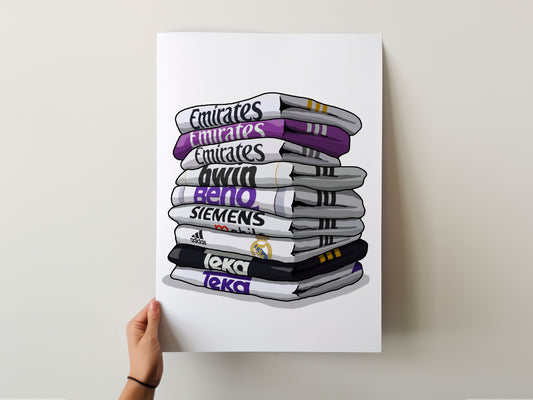 A hand is holding up a poster with a stack of towels, each towel displaying the name of a different sports team.