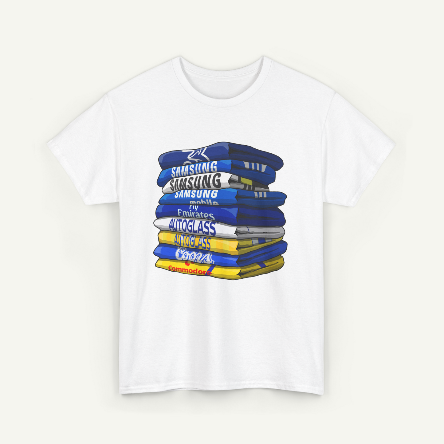 A white t-shirt with a graphic design depicting a stack of colorful books or magazines.