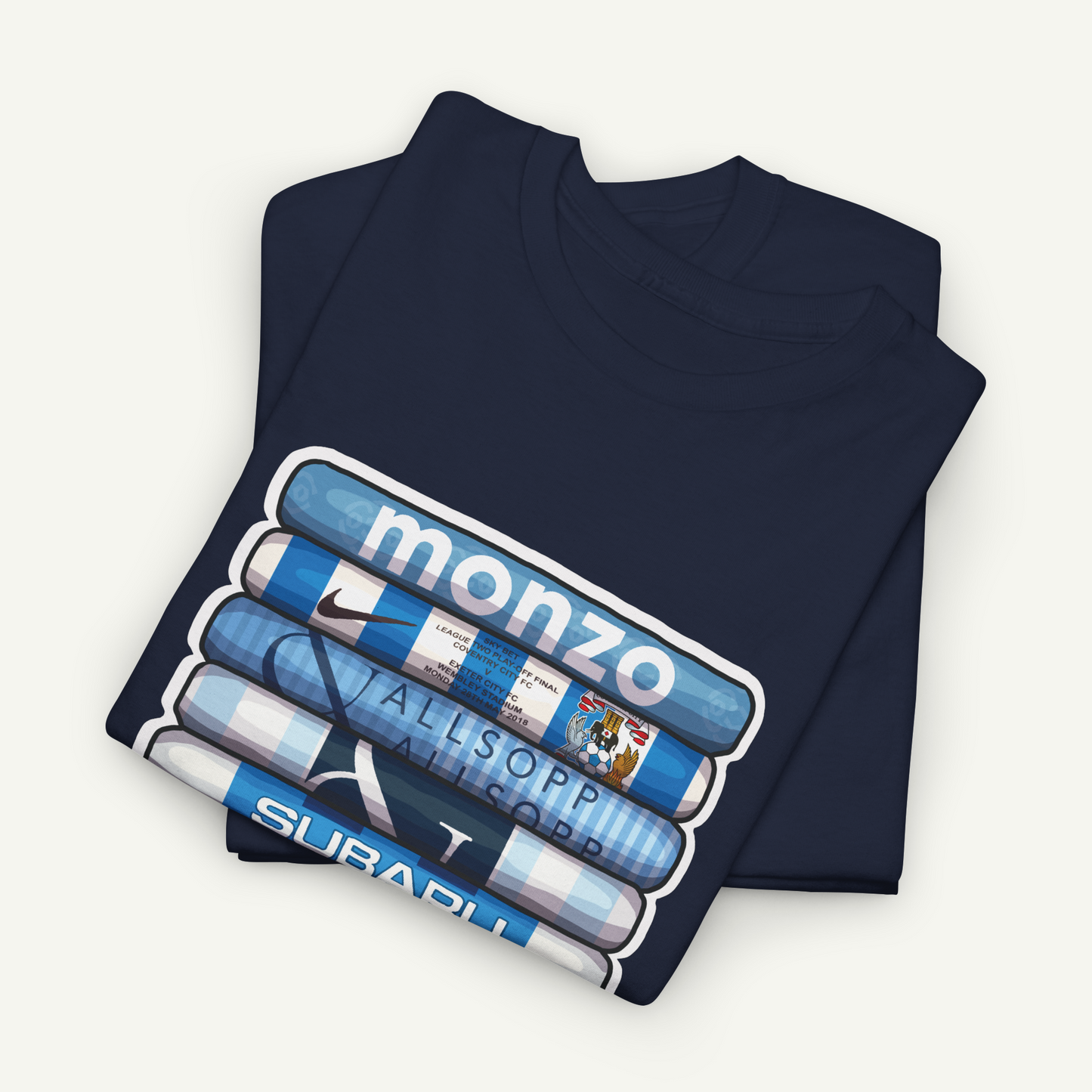 A dark blue t-shirt with a graphic design featuring a stack of blue and white tubes with the word "MONZO" printed on them.