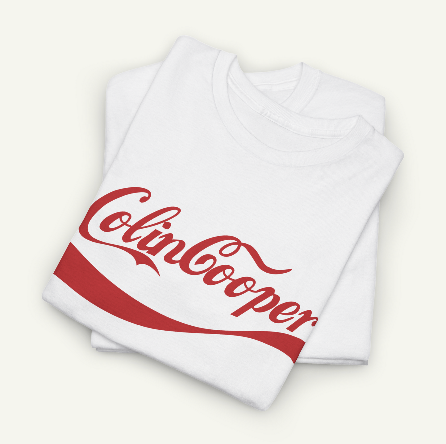 A white t-shirt with a red Coca-Cola logo printed on it.