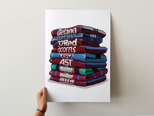 A hand is holding a poster with a stack of colorful shirts, each with a different name written on it.