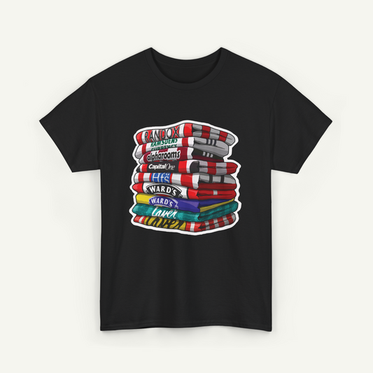 A black t-shirt with a graphic design depicting a stack of colorful towels with various text labels on them.