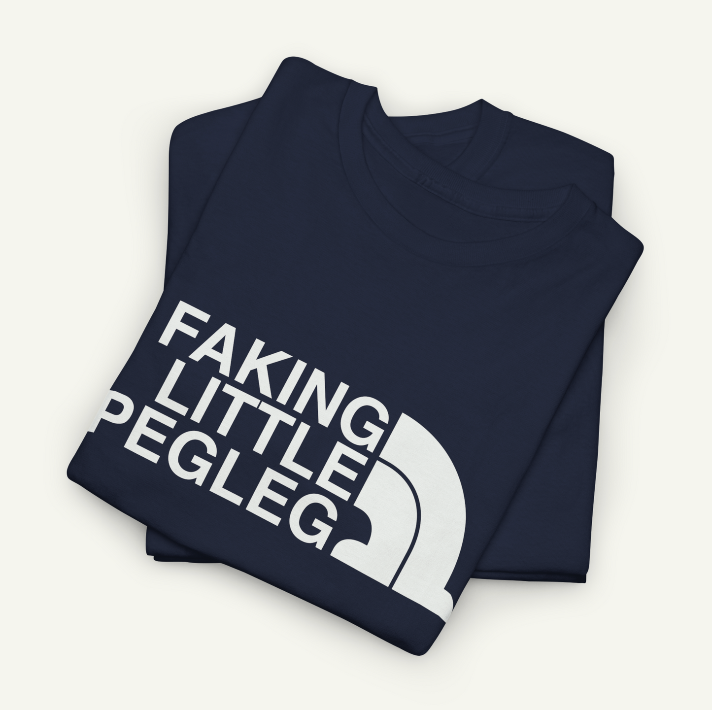 A navy blue t-shirt with the text "FAKING LITTLE PEGLEG" printed on it.
