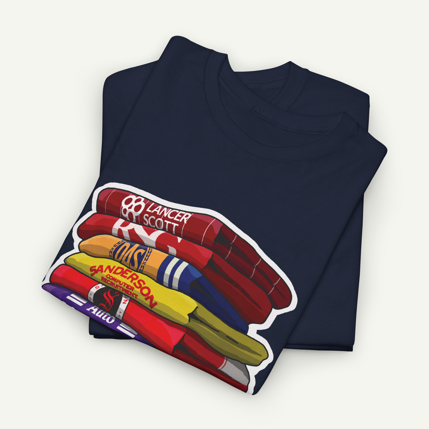 A navy blue t-shirt with a colorful graphic design depicting a stack of books or magazines.