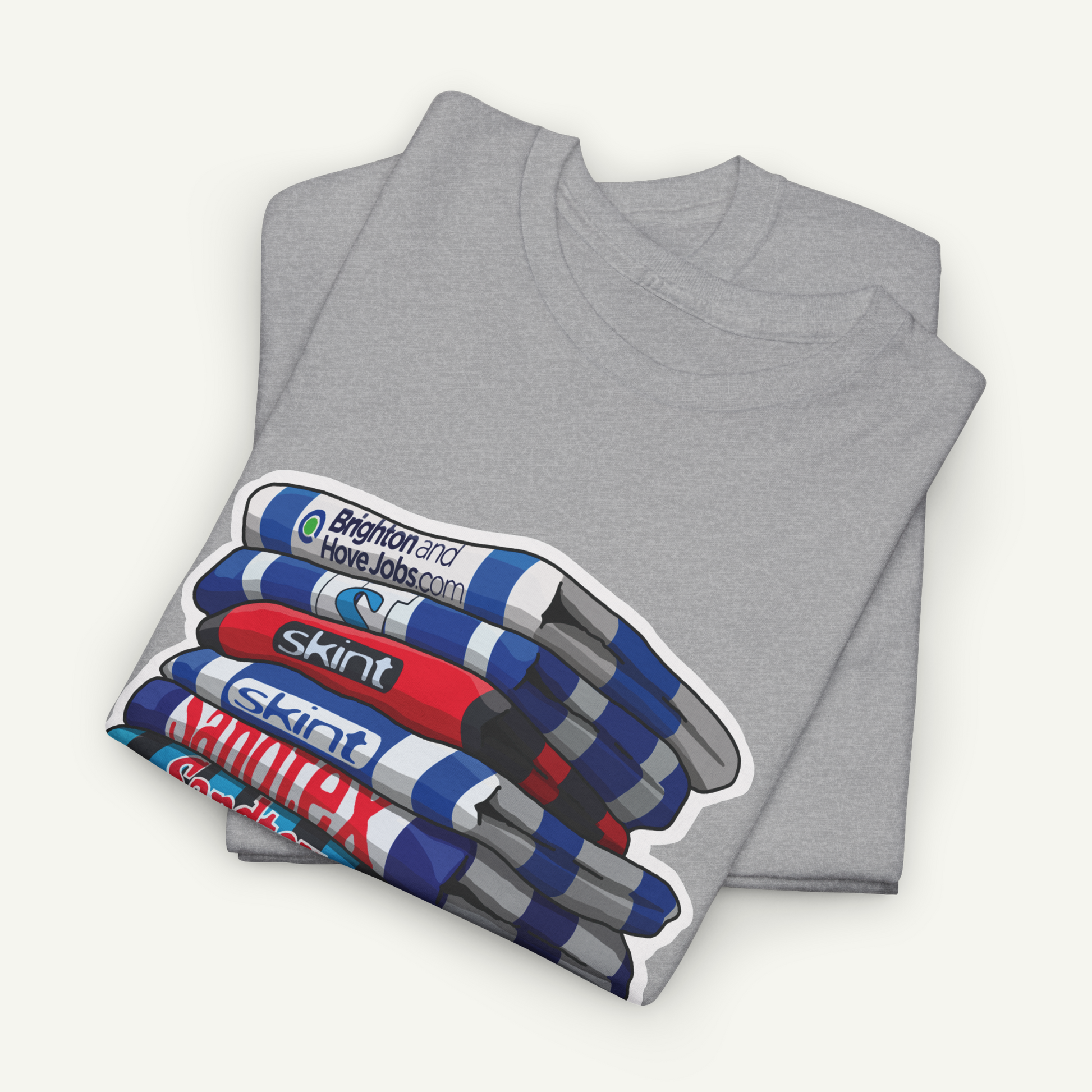 A gray t-shirt with a graphic design depicting a stack of colorful markers or highlighters.