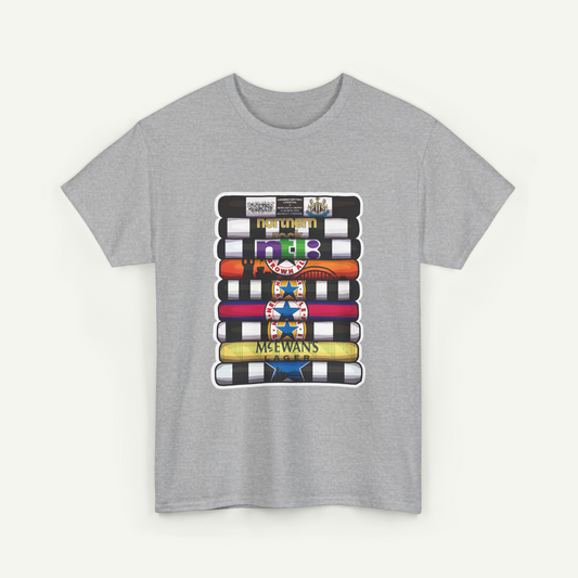 A gray t-shirt with a graphic design featuring a stack of colorful books or magazines.