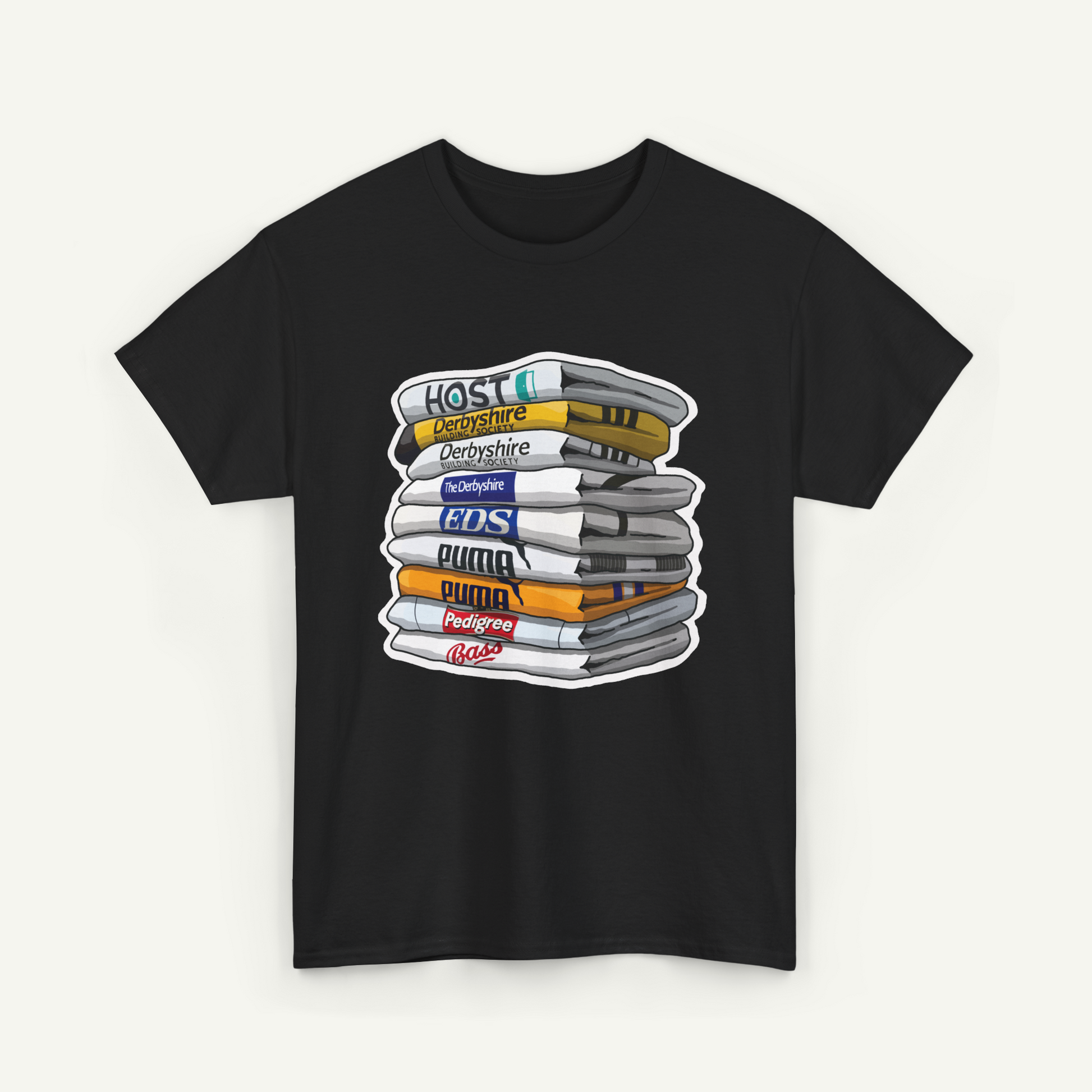 A black t-shirt with a graphic design depicting a stack of books or magazines with various colored covers, representing different types of media or content.