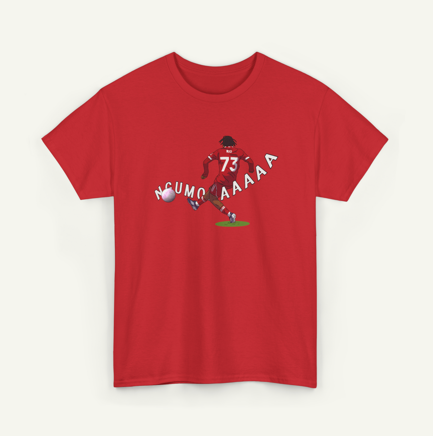 A red t-shirt with a graphic design depicting a soccer player kicking a ball, accompanied by the text "NCUMO AAAA" in a playful font.