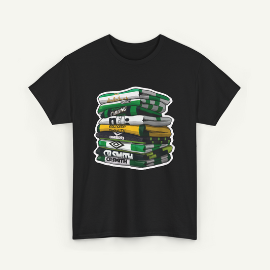 A black t-shirt with a graphic design depicting a stack of colorful books or magazines.