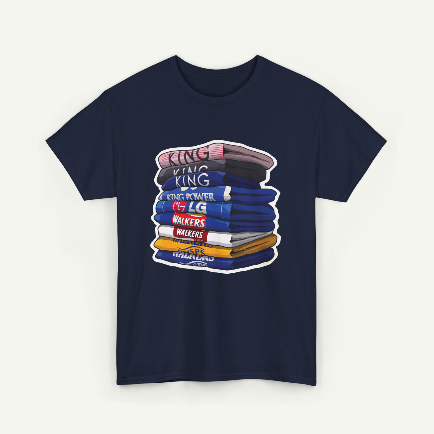 A navy blue t-shirt with a graphic design depicting a stack of colorful books or books with the text "KING KING" written on them.