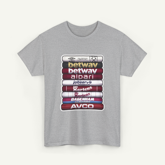 A gray t-shirt with a graphic design featuring a stack of colorful tubes or tubes with various text and logos printed on them.