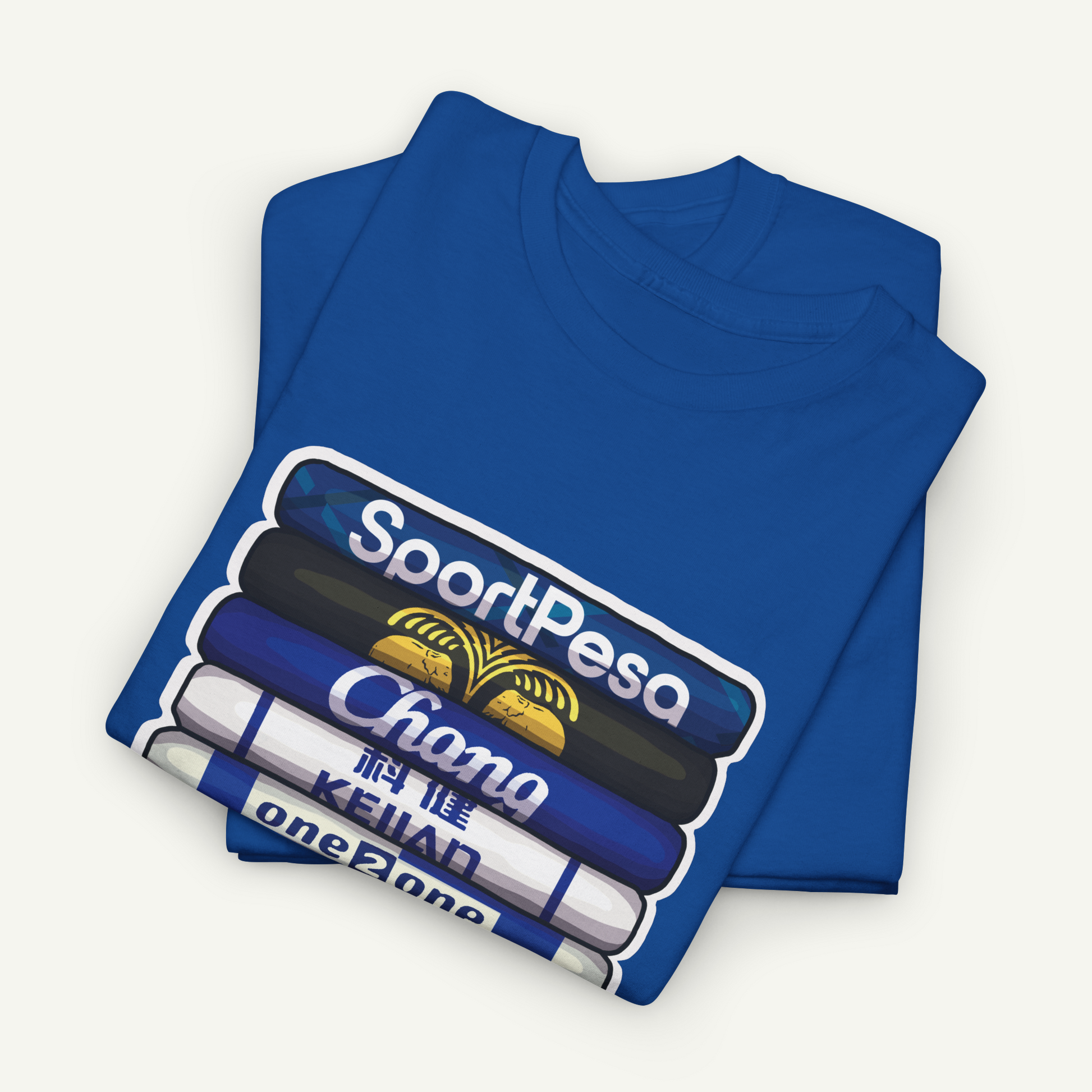 A blue t-shirt with a graphic design depicting a stack of books or magazines with the text "SportPesa Chana Keiyan" printed on them.