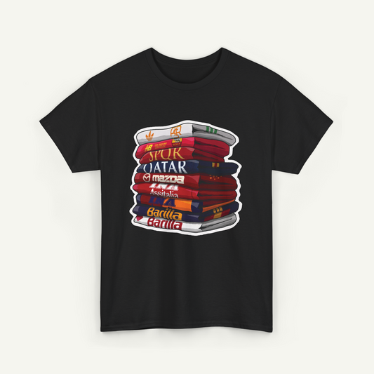 A black t-shirt with a graphic design depicting a stack of colorful books with various text on the spines.