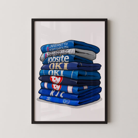 A framed illustration of a stack of blue and white towels with text on them, including "University ofortsmouth", "topsite", "OKI", and "KIC".