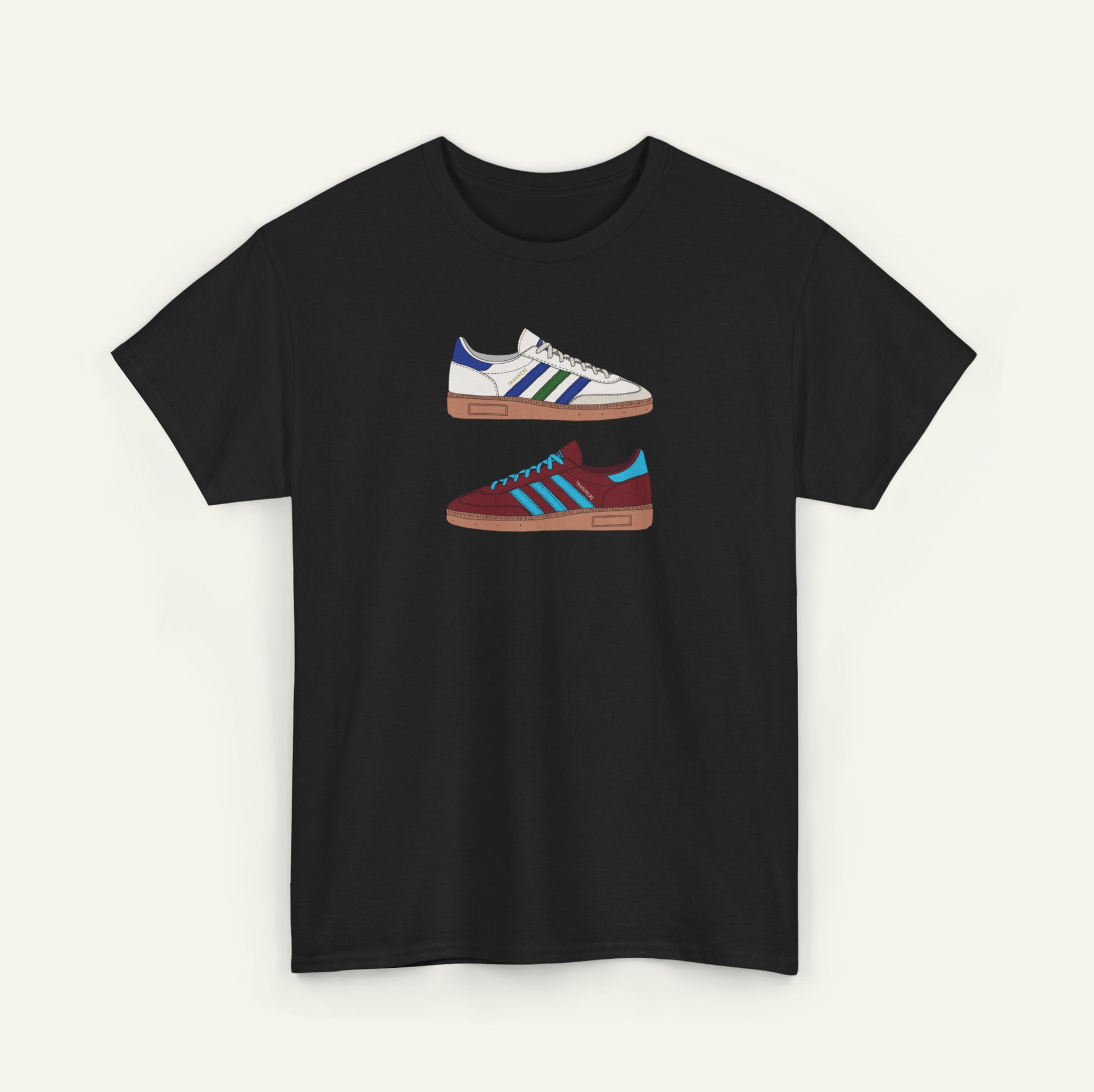 A black t-shirt with a graphic design of two different colored Adidas sneakers.