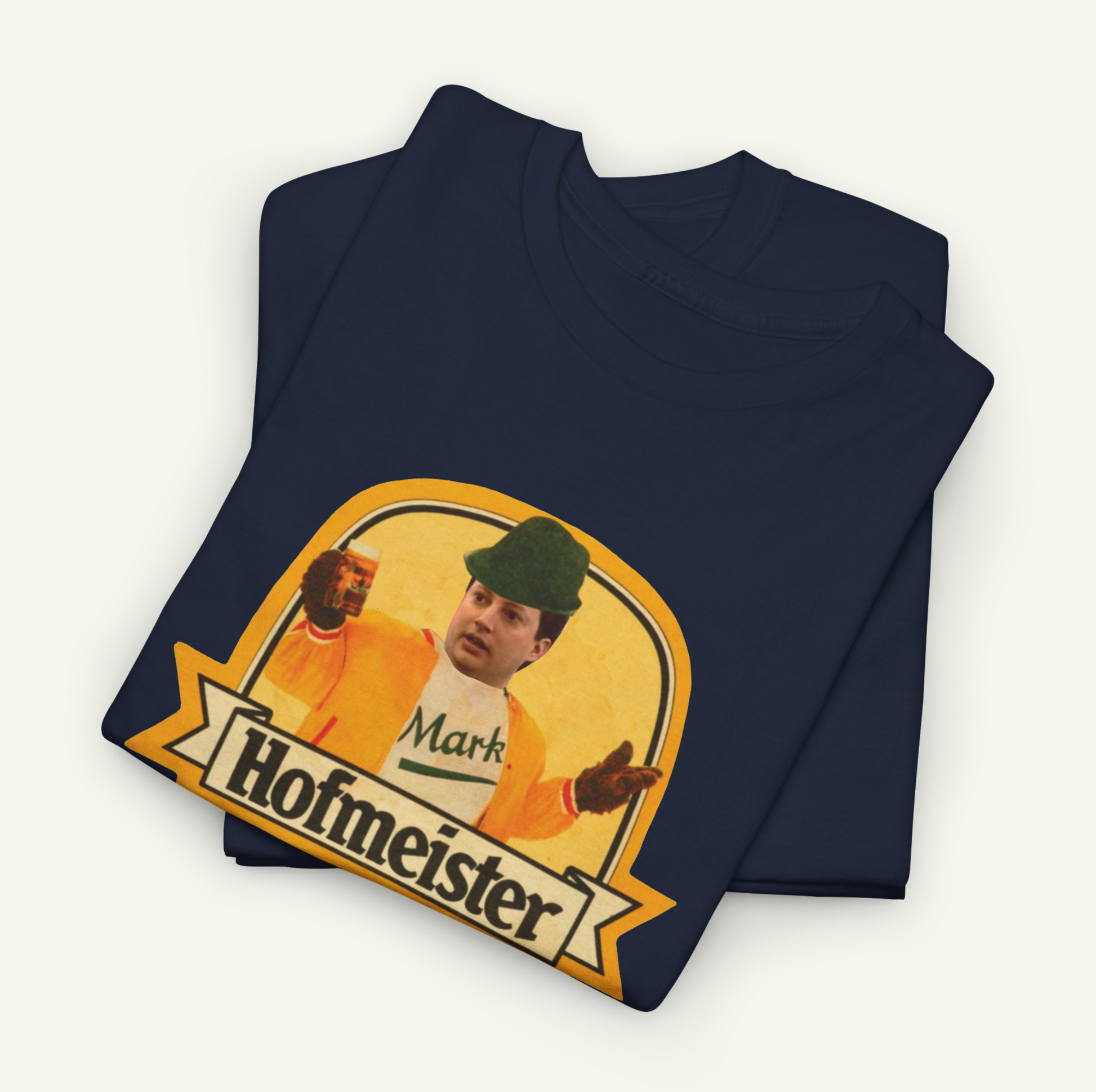 a dark blue t-shirt with a graphic design depicting a man wearing a hat and holding a beer. The text "Hofmeister" is visible below the graphic.