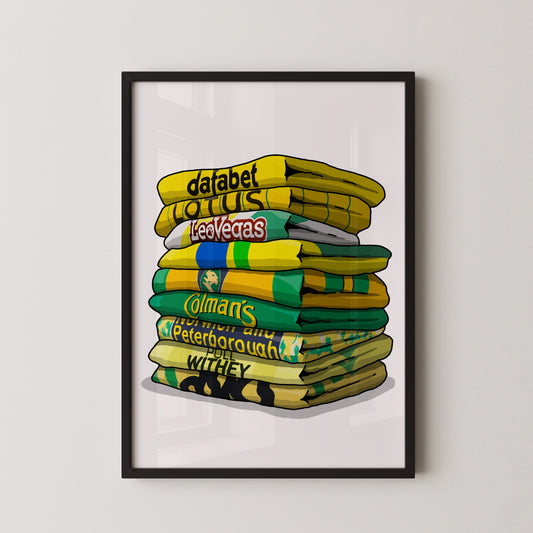 A framed illustration of a stack of colorful towels with various text and logos printed on them.