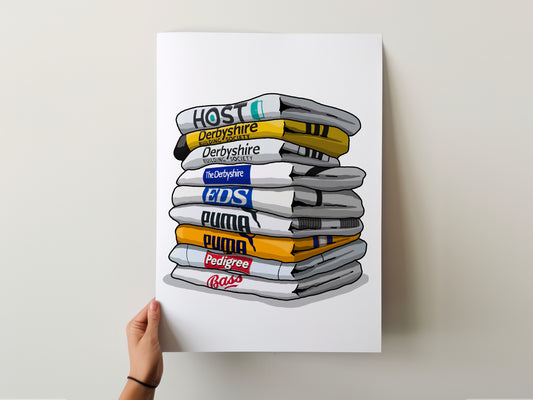 A hand is holding a poster with a stack of various products, including a yellow and black item labeled 'Host', a white and blue item labeled 'Derbyshire', a white and blue item labeled 'EDS', a white and yellow item labeled 'Puma', a white and yellow item labeled 'Pedigree', and a white and yellow item labeled 'Bass'.