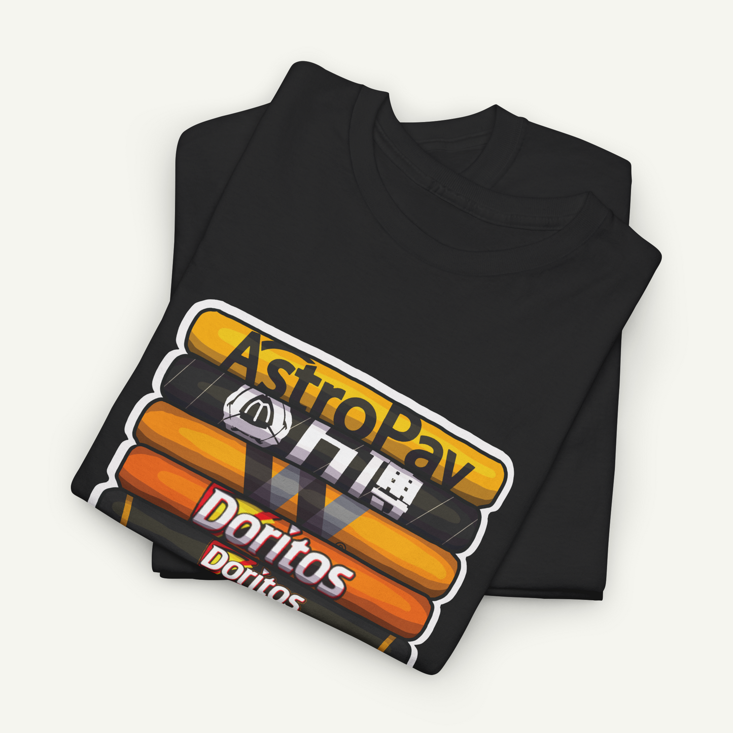 A black t-shirt with a graphic design featuring stacked orange and yellow bars, along with the text "AstroPay Doritos" printed on it.