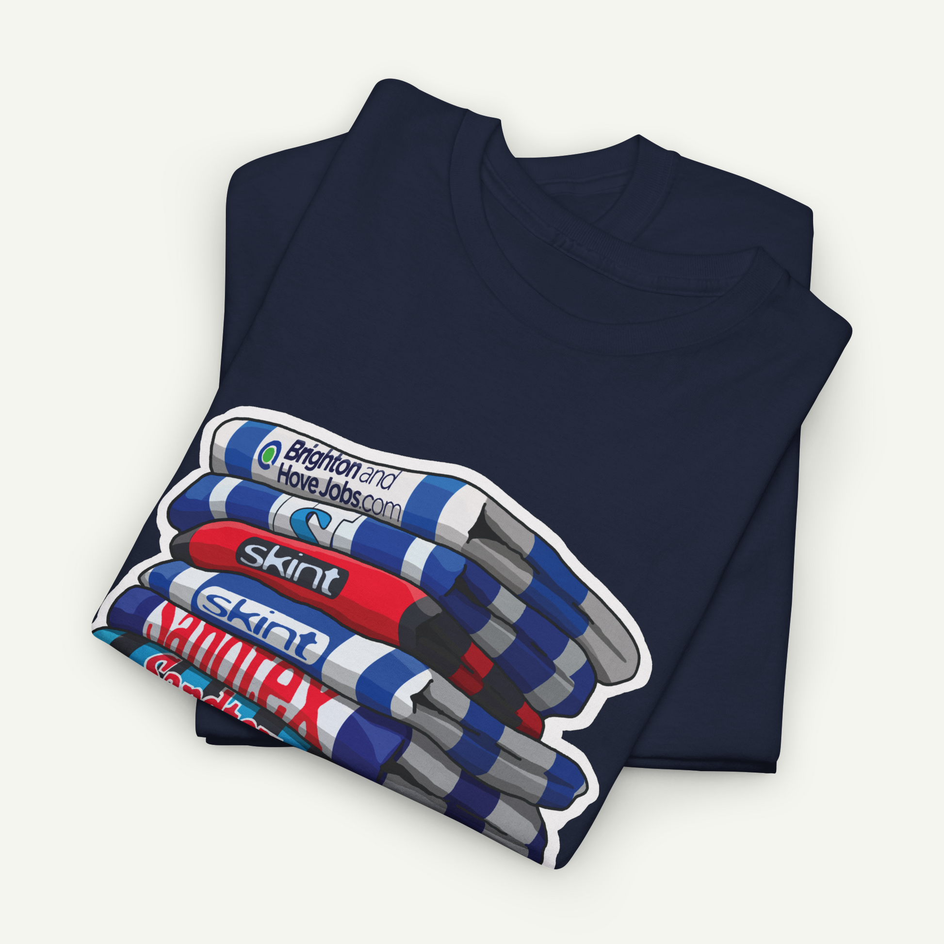 A navy blue t-shirt with a graphic design depicting a stack of colorful markers or highlighters.