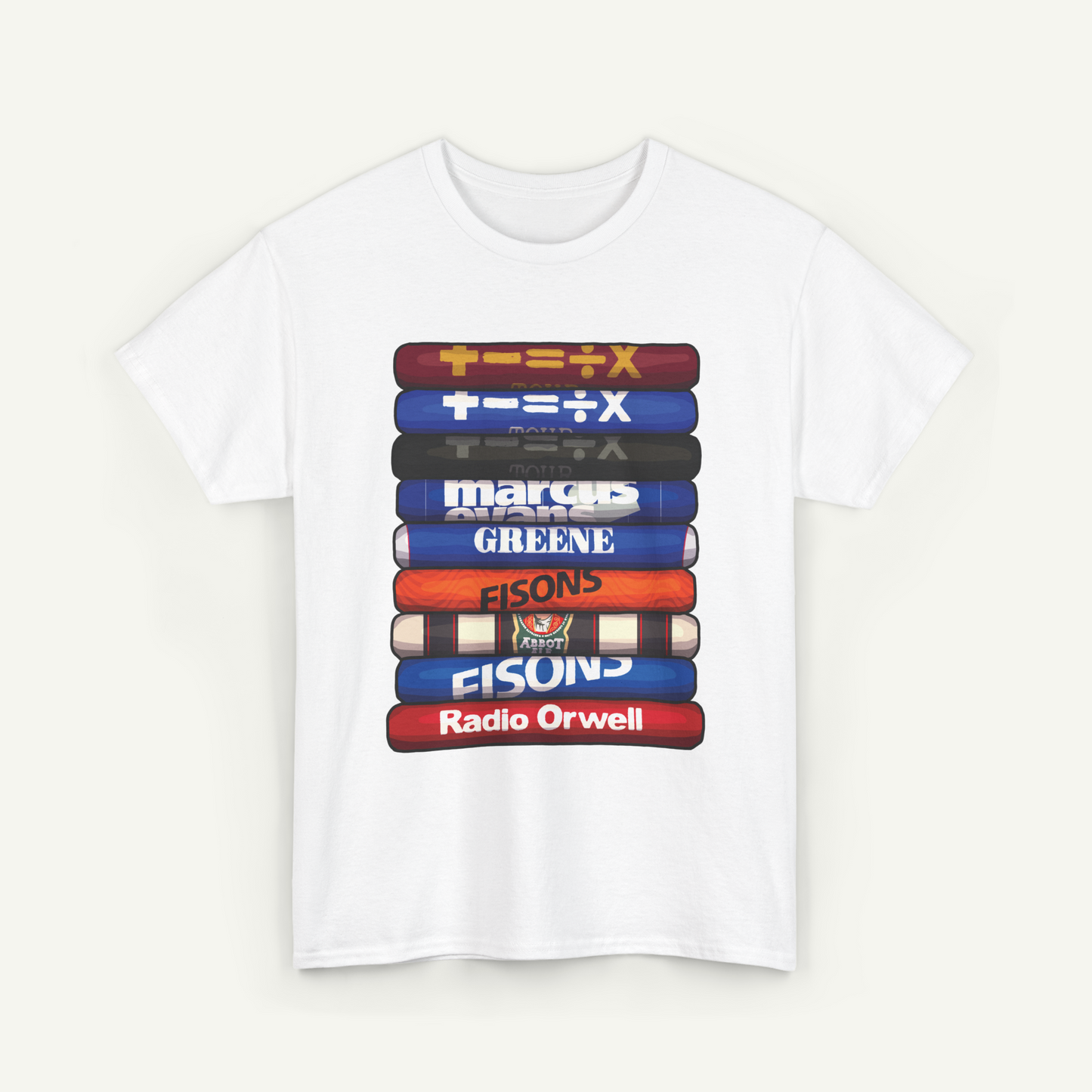 A white t-shirt with a graphic design featuring a stack of colorful books or magazines with various text and logos on them.