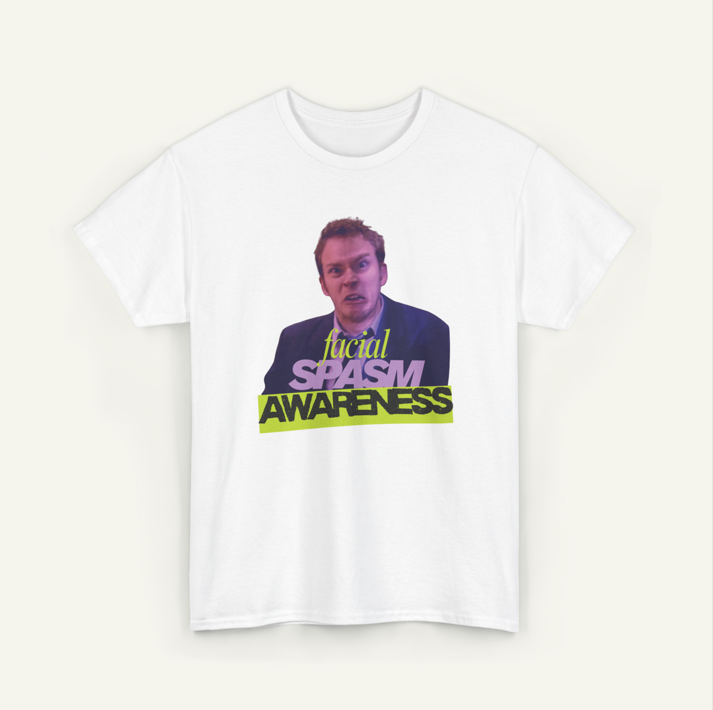 A white t-shirt with a graphic design featuring a man's face and the text "Local Spasm Awareness" in a stylized font.