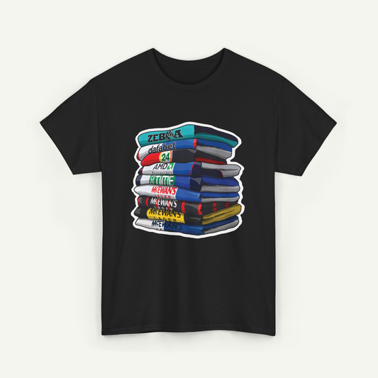 A black t-shirt with a graphic design depicting a stack of colorful books or magazines.