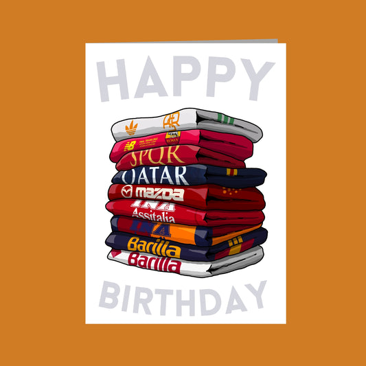 A stack of colorful towels with various logos and text, including "SPORT", "QATAR", "MAZDA", "ASSINIA", "Barilla", and "BARILLA". The text "HAPPY BIRTHDAY" is displayed at the top of the image.