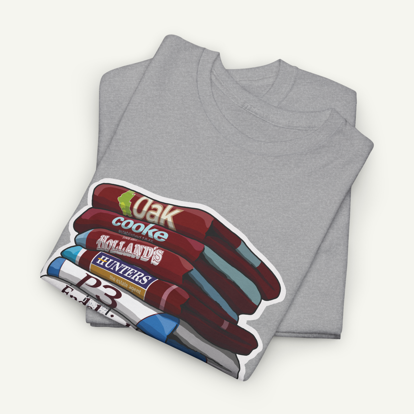 A gray t-shirt with a graphic design depicting a stack of various colored pencils.