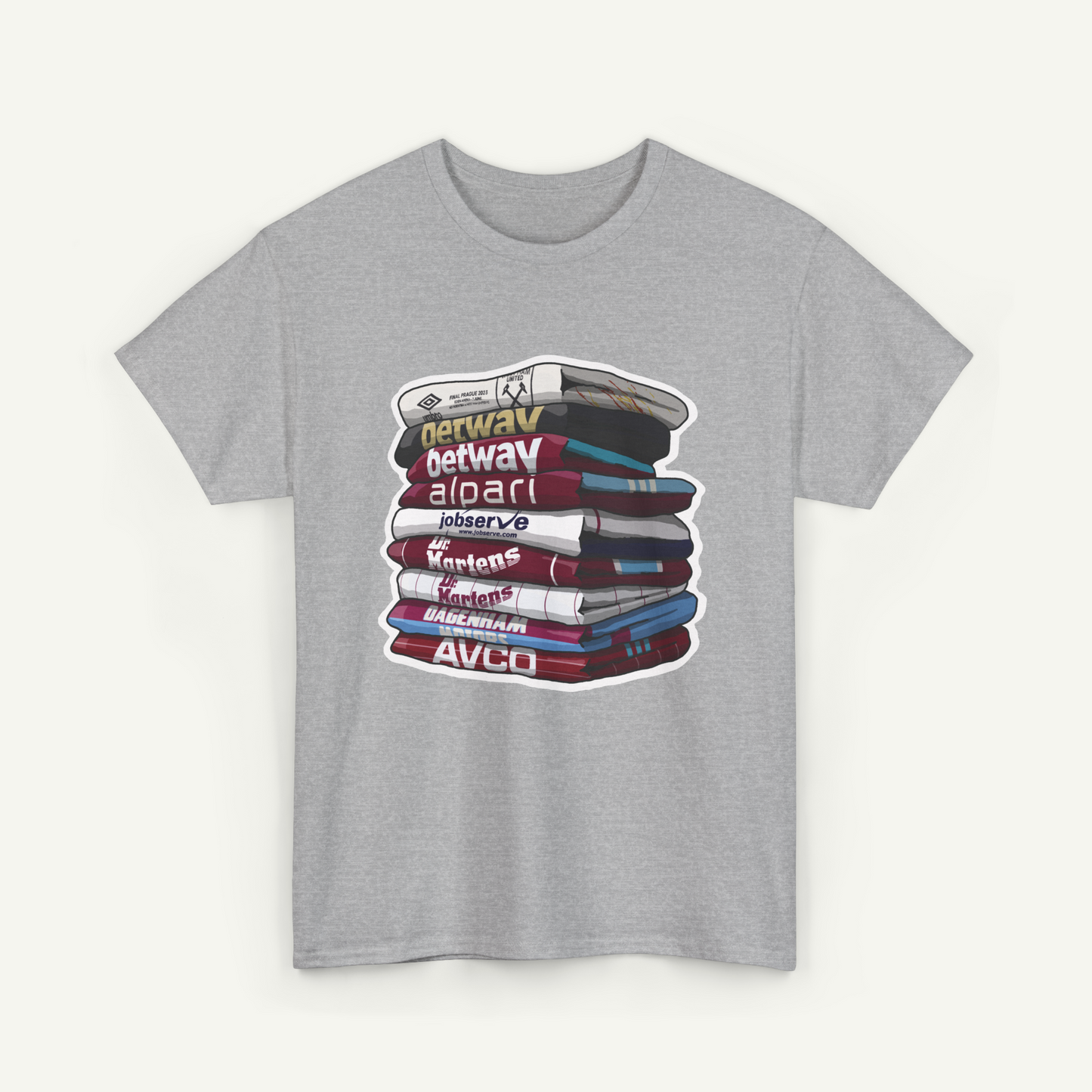 A gray t-shirt with a graphic design depicting a stack of books with various text labels on the spines.