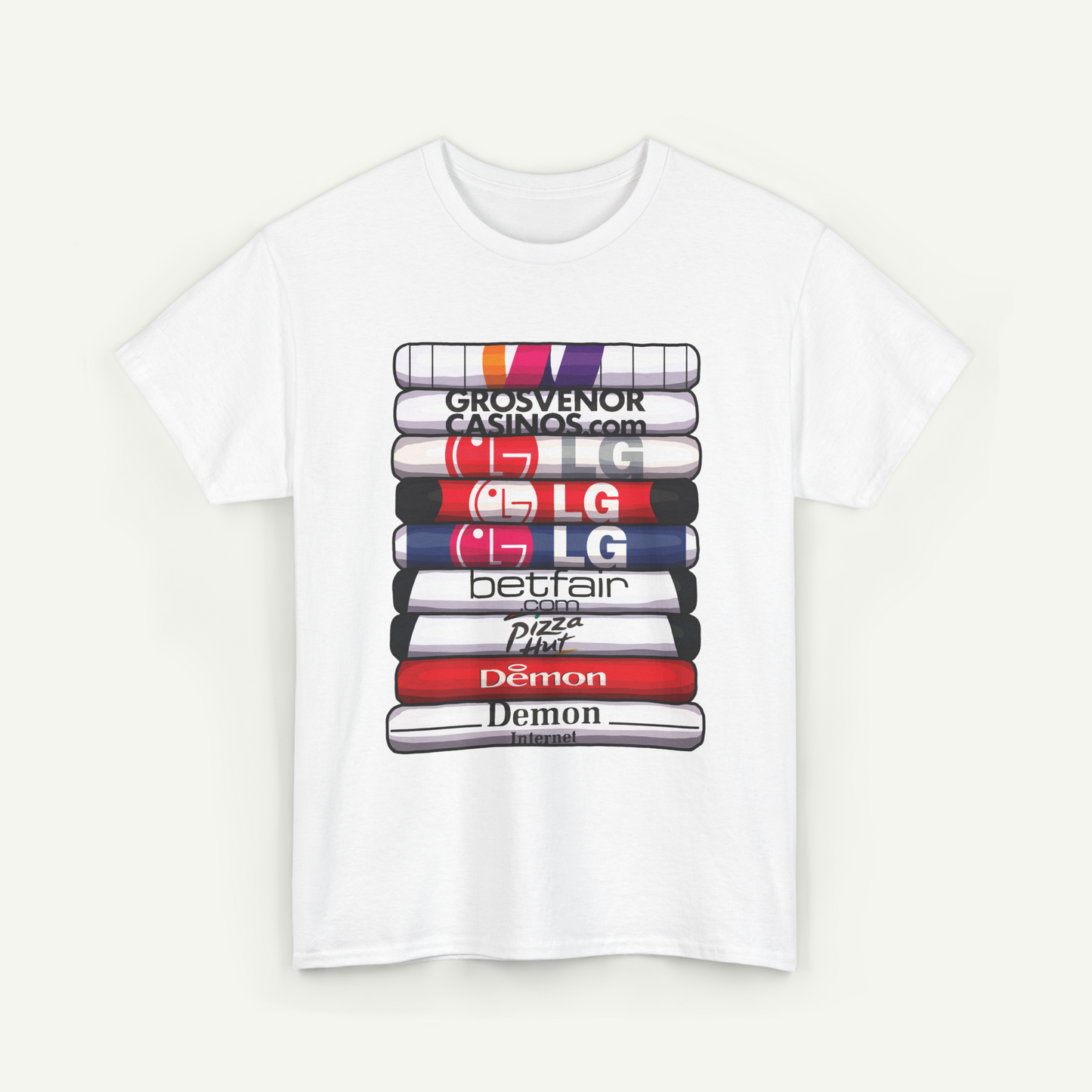 A white t-shirt with a graphic design featuring a stack of colorful books or magazines with various logos printed on them.
