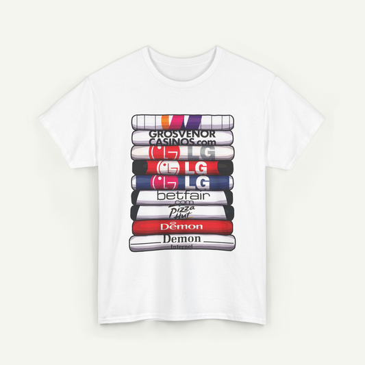 A white t-shirt with a graphic design featuring a stack of colorful books or magazines with various logos printed on them.