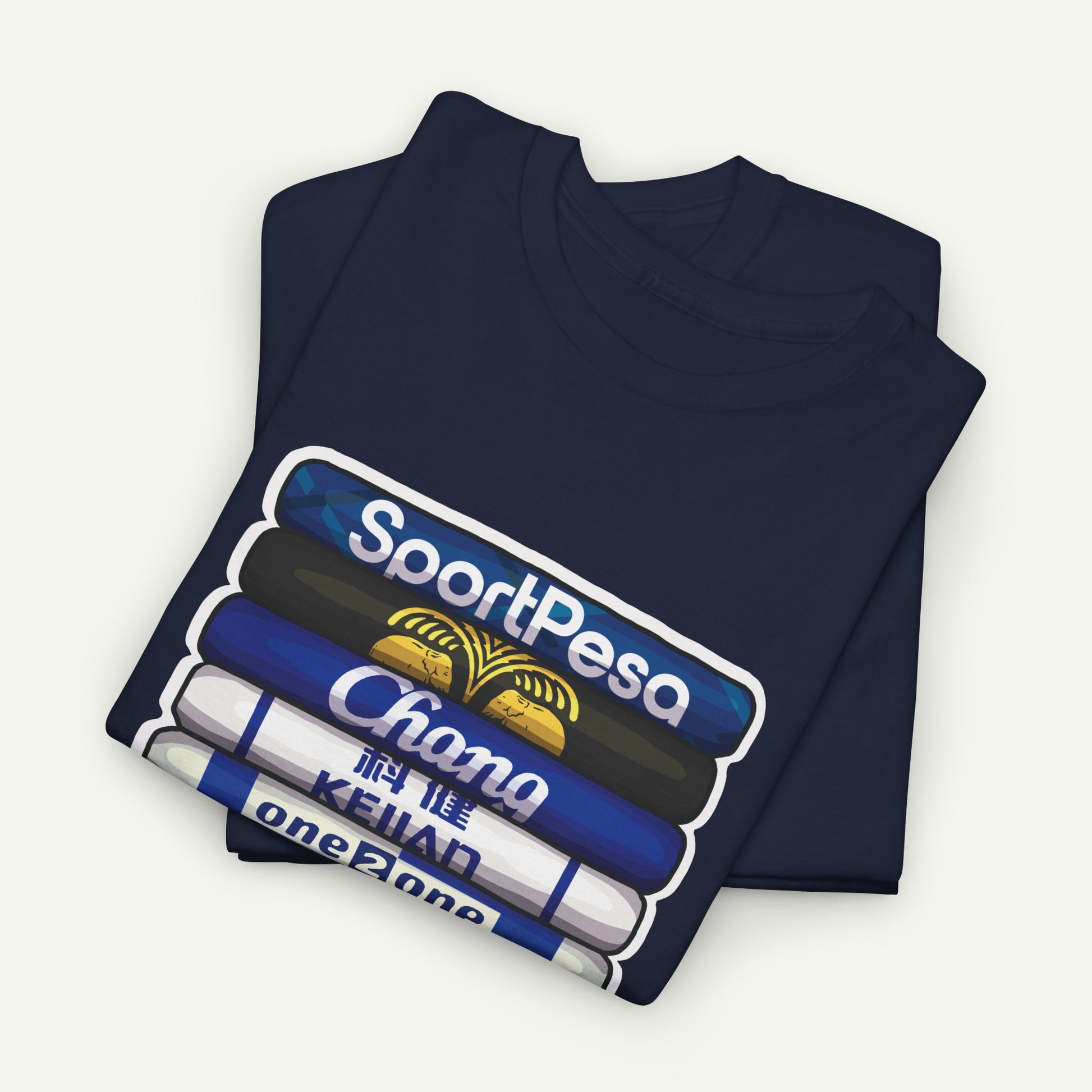 A dark blue t-shirt with a graphic design depicting a stack of books or magazines with the text "SportPesa Chana Keiad one zone" printed on it.