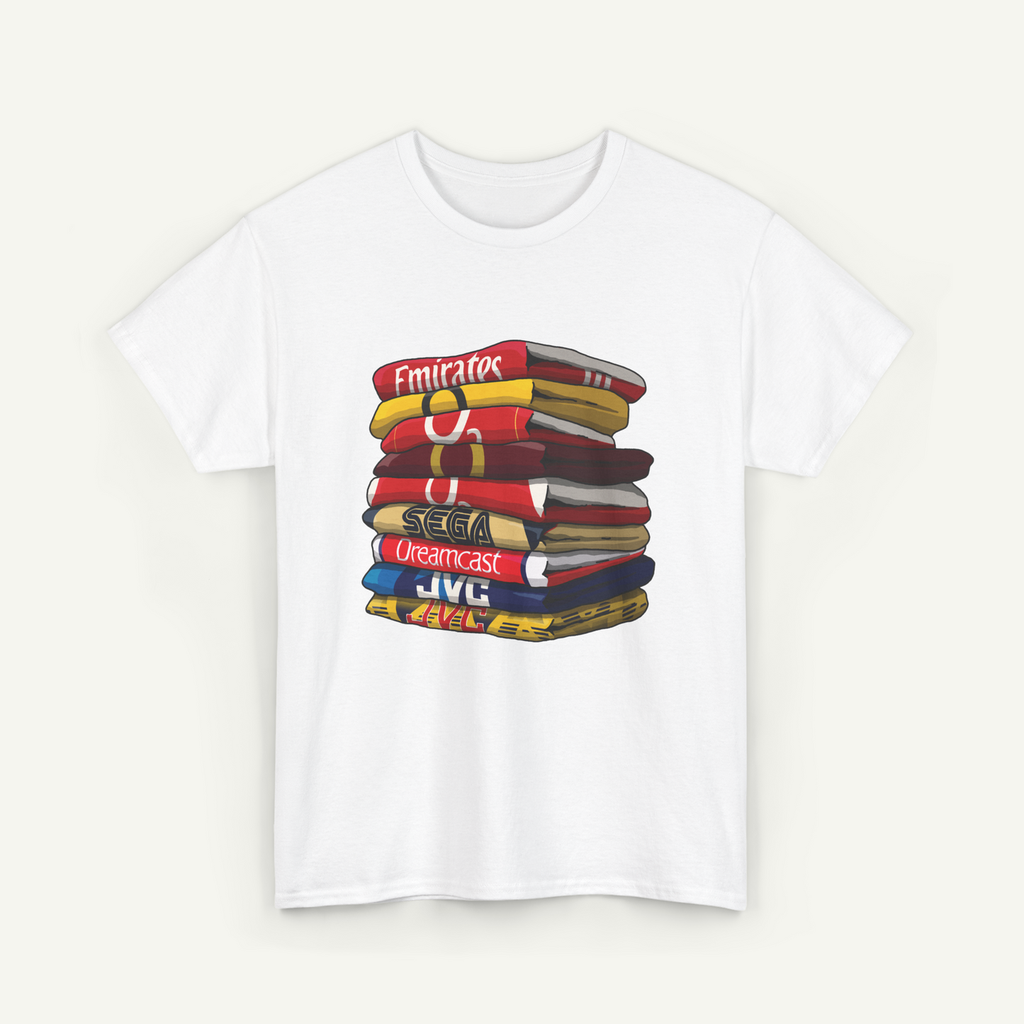 A white t-shirt with a graphic design depicting a stack of colorful books or magazines.