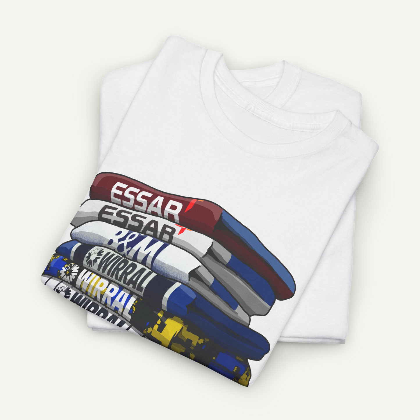 A white t-shirt with a graphic design depicting a stack of books or bookshelves in various colors.