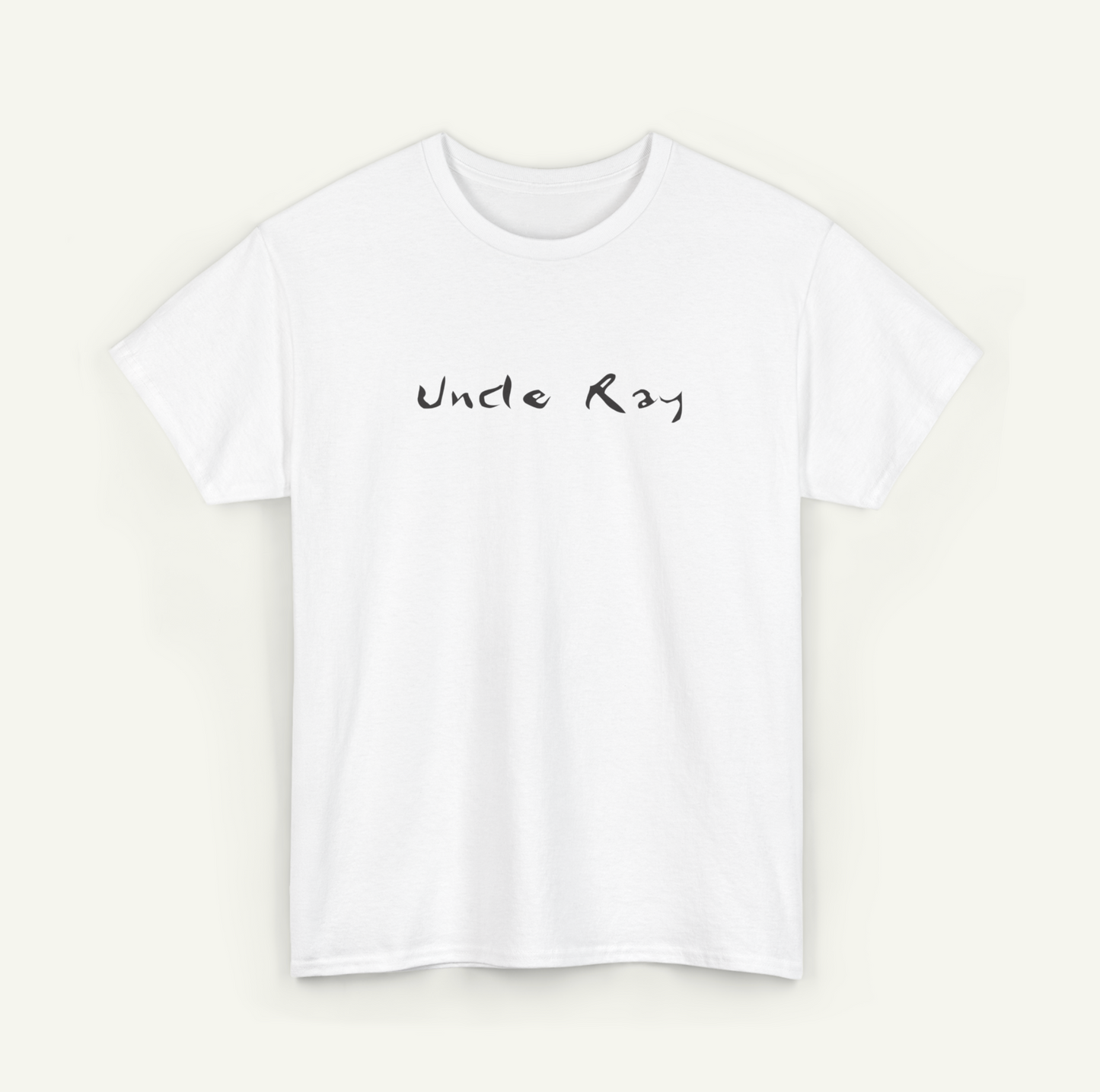 A white t-shirt with the text "Uncle Ray" printed on it in a handwritten style.