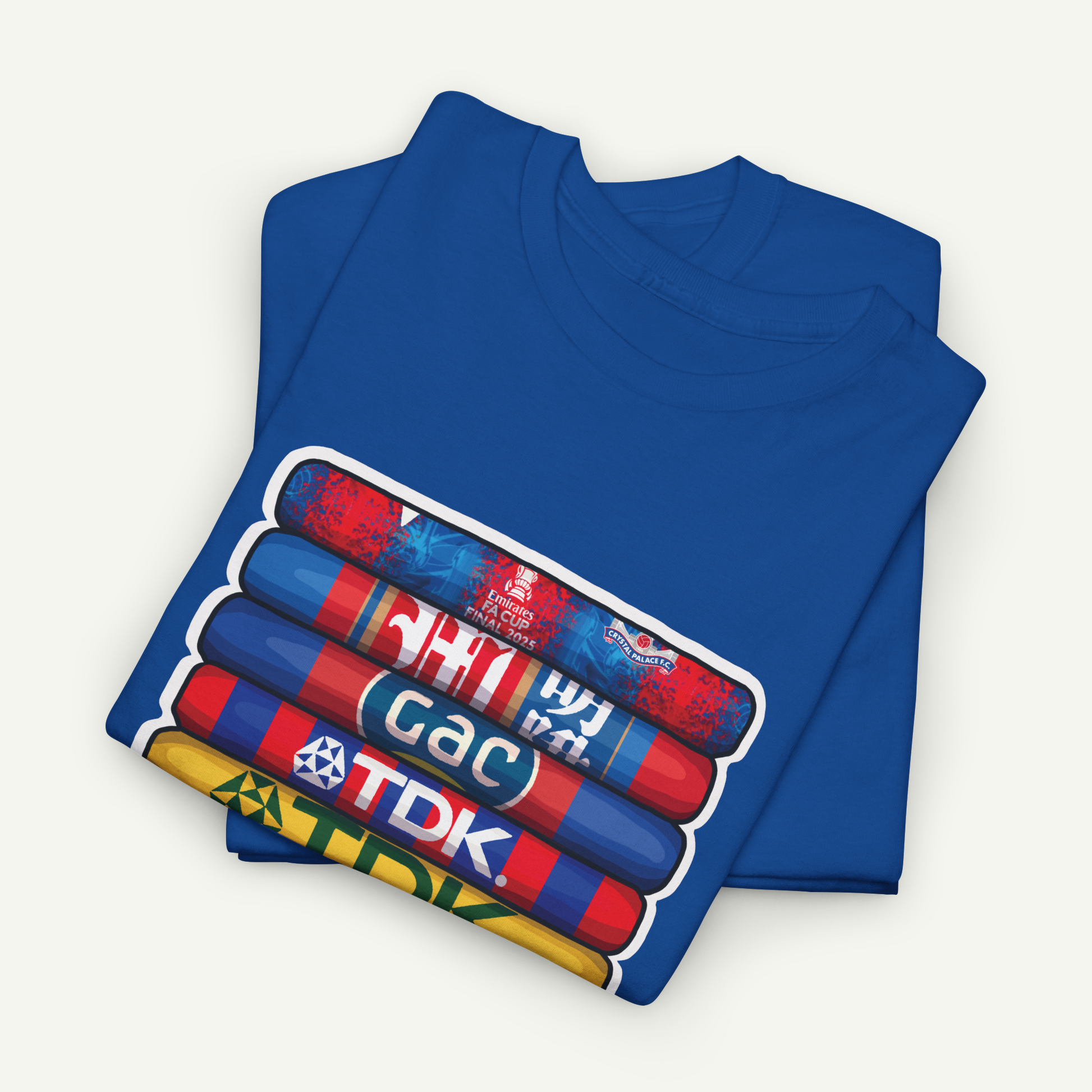 A blue t-shirt with a graphic design featuring a stack of colorful tubes or bottles with text on them.