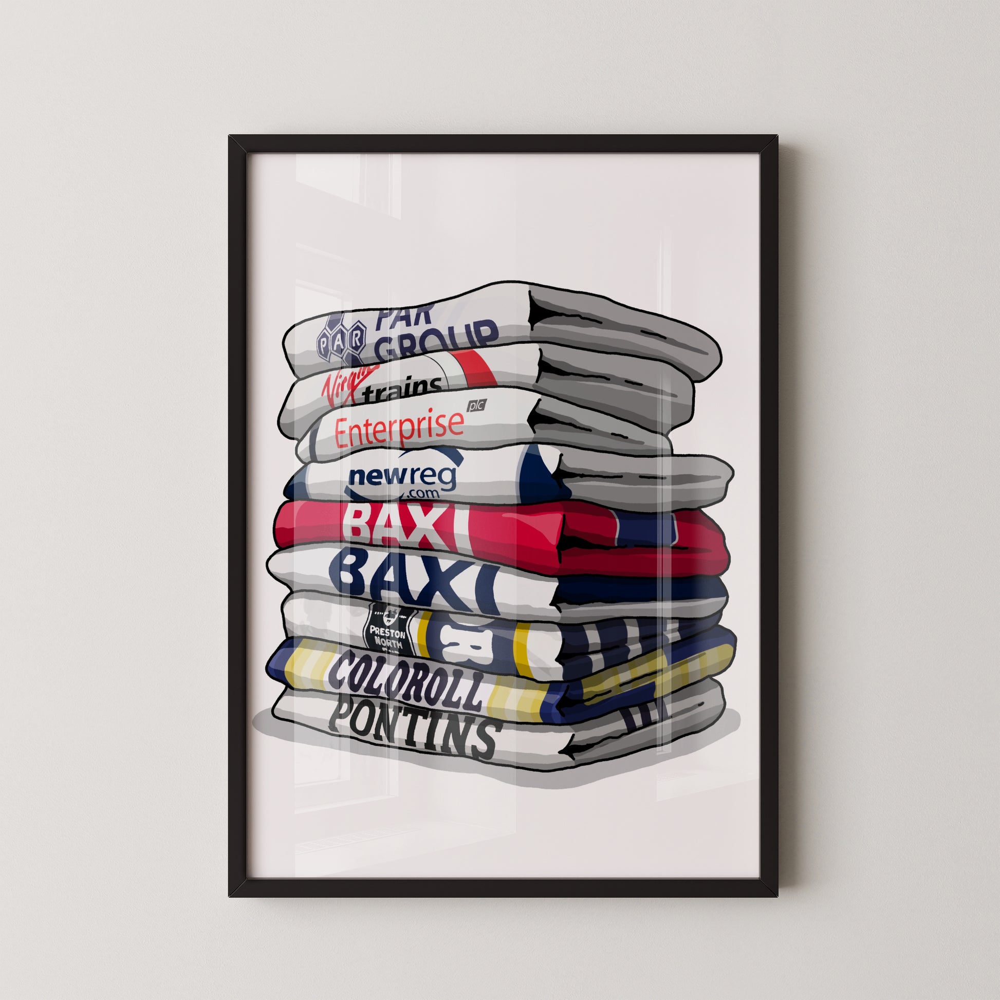 A framed illustration of a stack of various colored towels, each with a different logo or text on them.