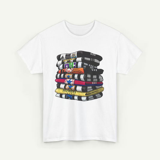 A white t-shirt with a graphic design depicting a stack of colorful books or magazines.