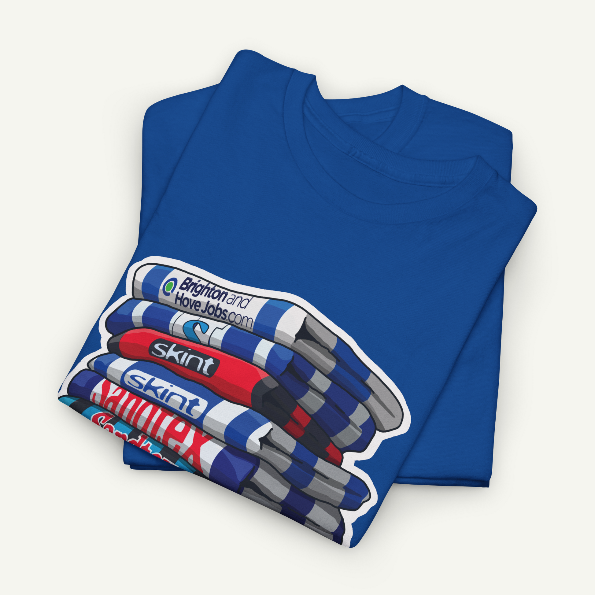 A blue t-shirt with a graphic design depicting a stack of colorful markers or highlighters.