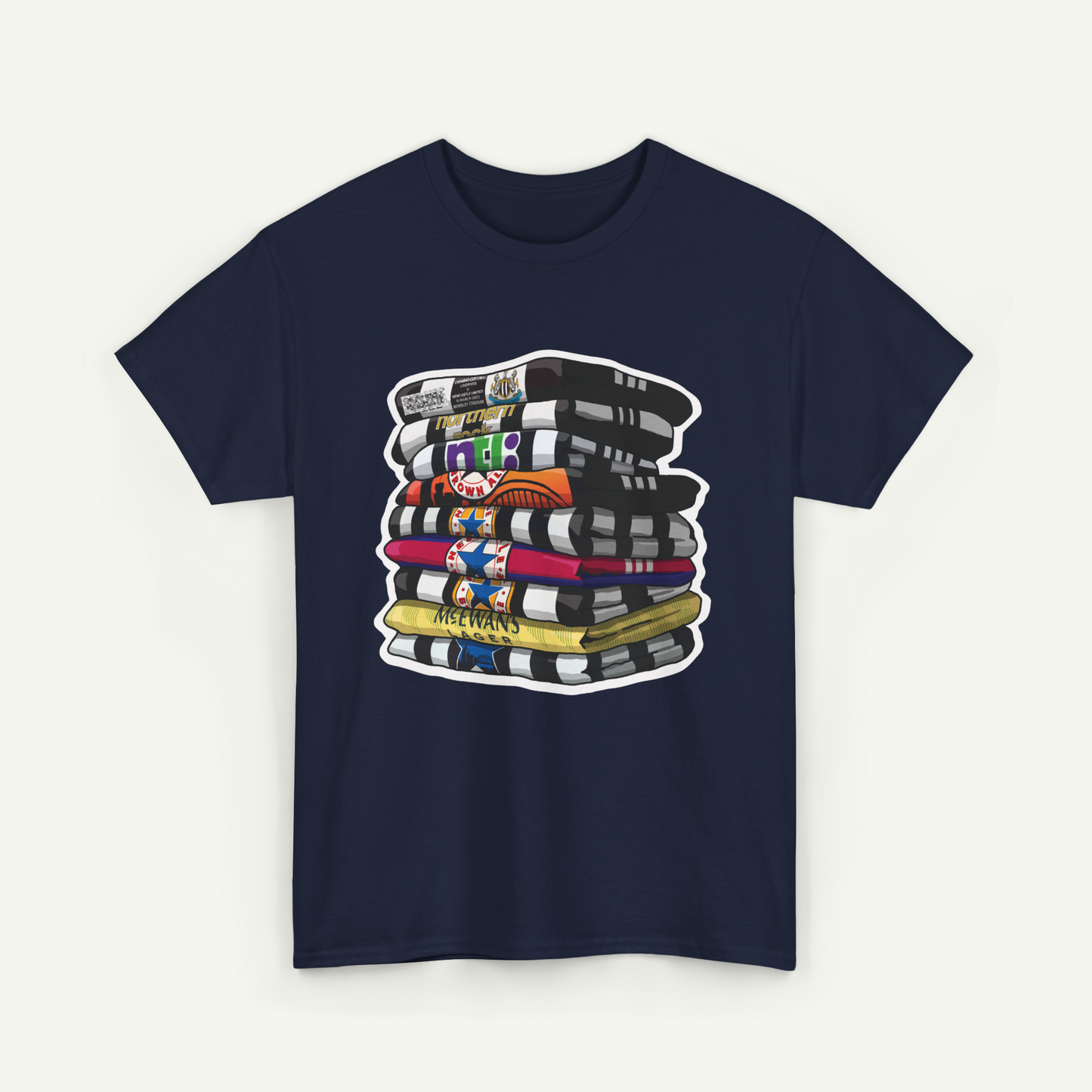 A navy blue t-shirt with a graphic design depicting a stack of colorful books or magazines.
