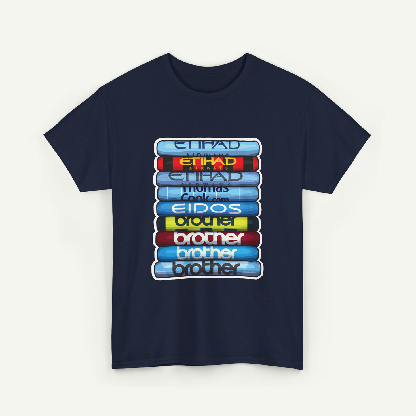 A navy blue t-shirt with a graphic design depicting a stack of colorful books or magazines with the text "Etihad Thomas Eidos brother brother" printed on them.