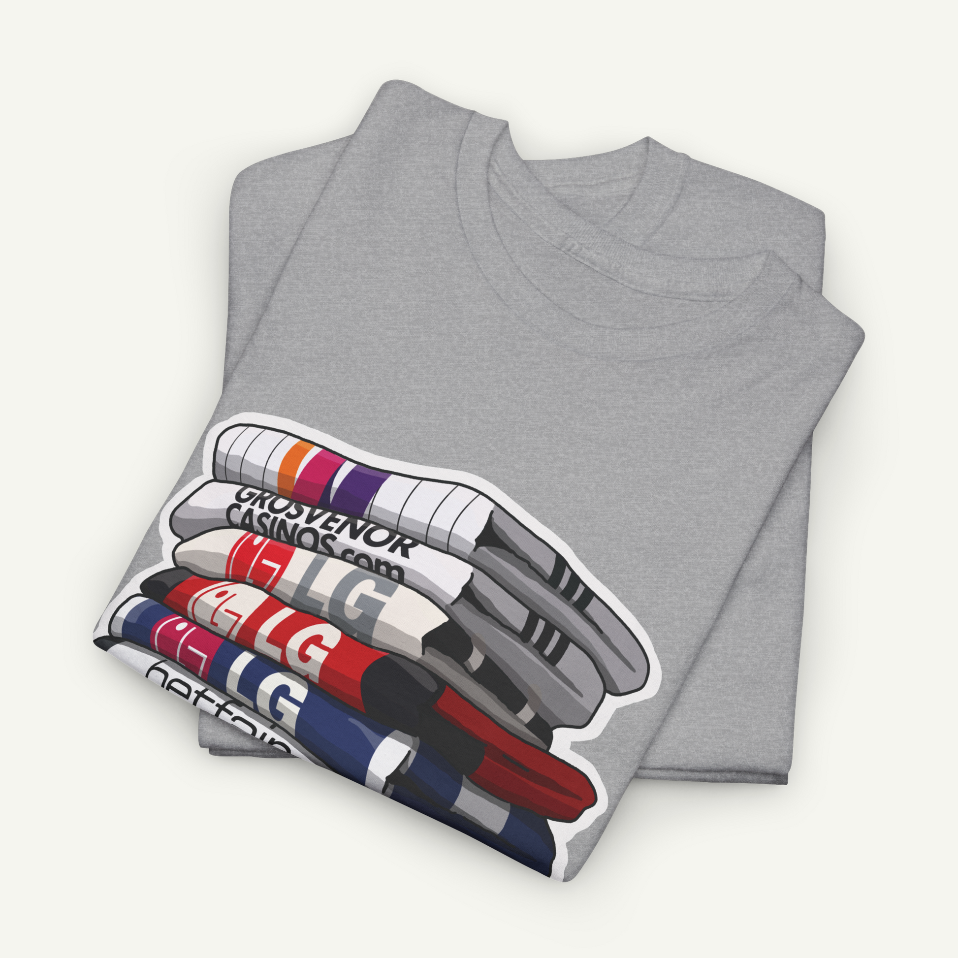 A gray t-shirt with a graphic design depicting a stack of colorful markers or pens.