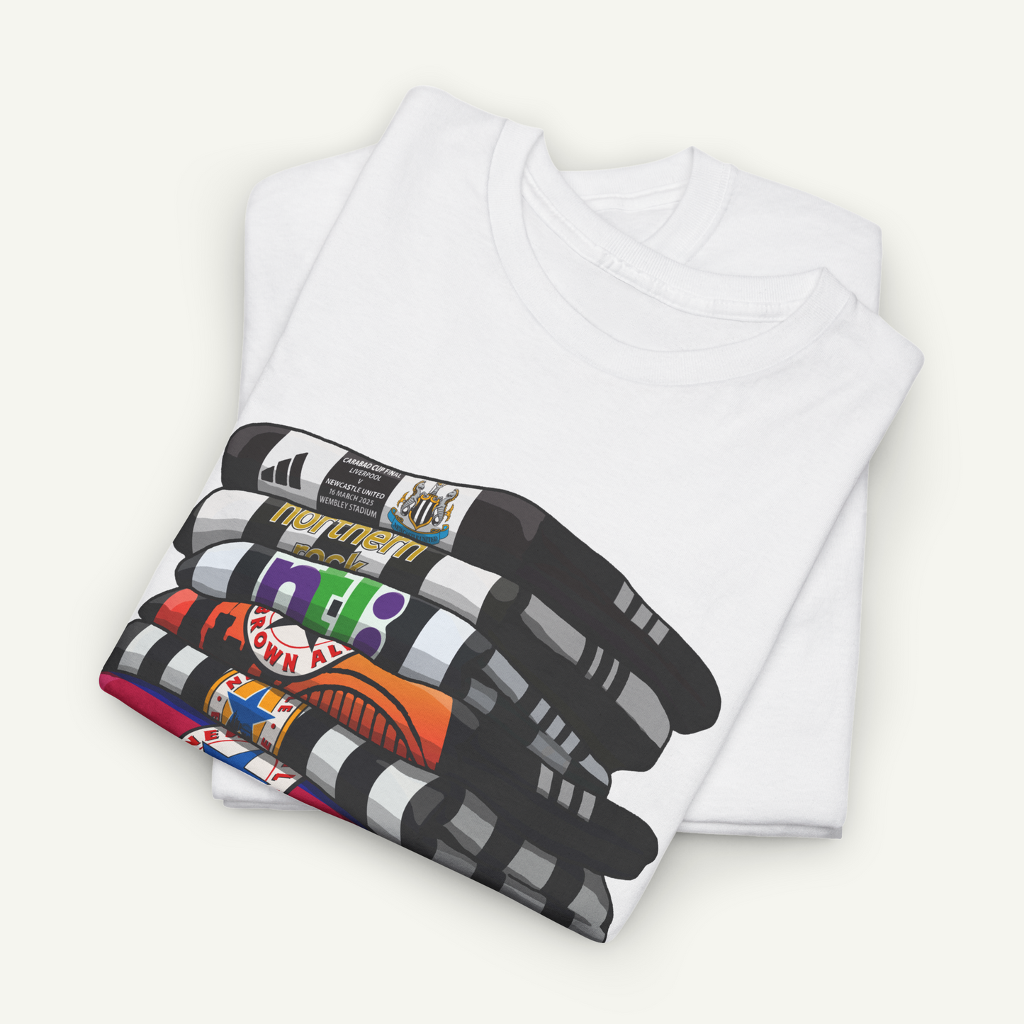 A white t-shirt with a colorful graphic design depicting a stack of various objects, including a basketball, a baseball, and a pair of sunglasses.
