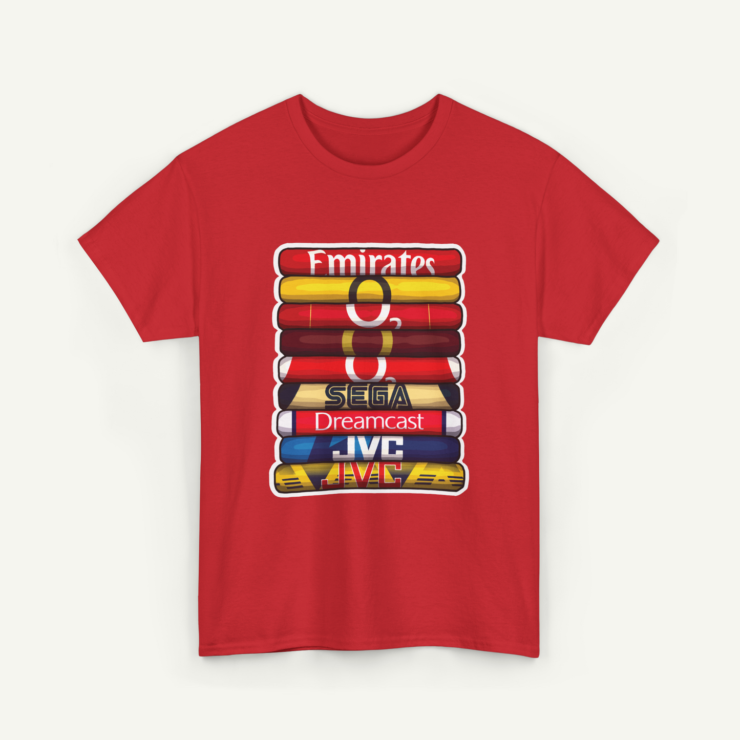 A red t-shirt with a graphic design featuring a stack of colorful books or magazines, each with a different logo or text on it.
